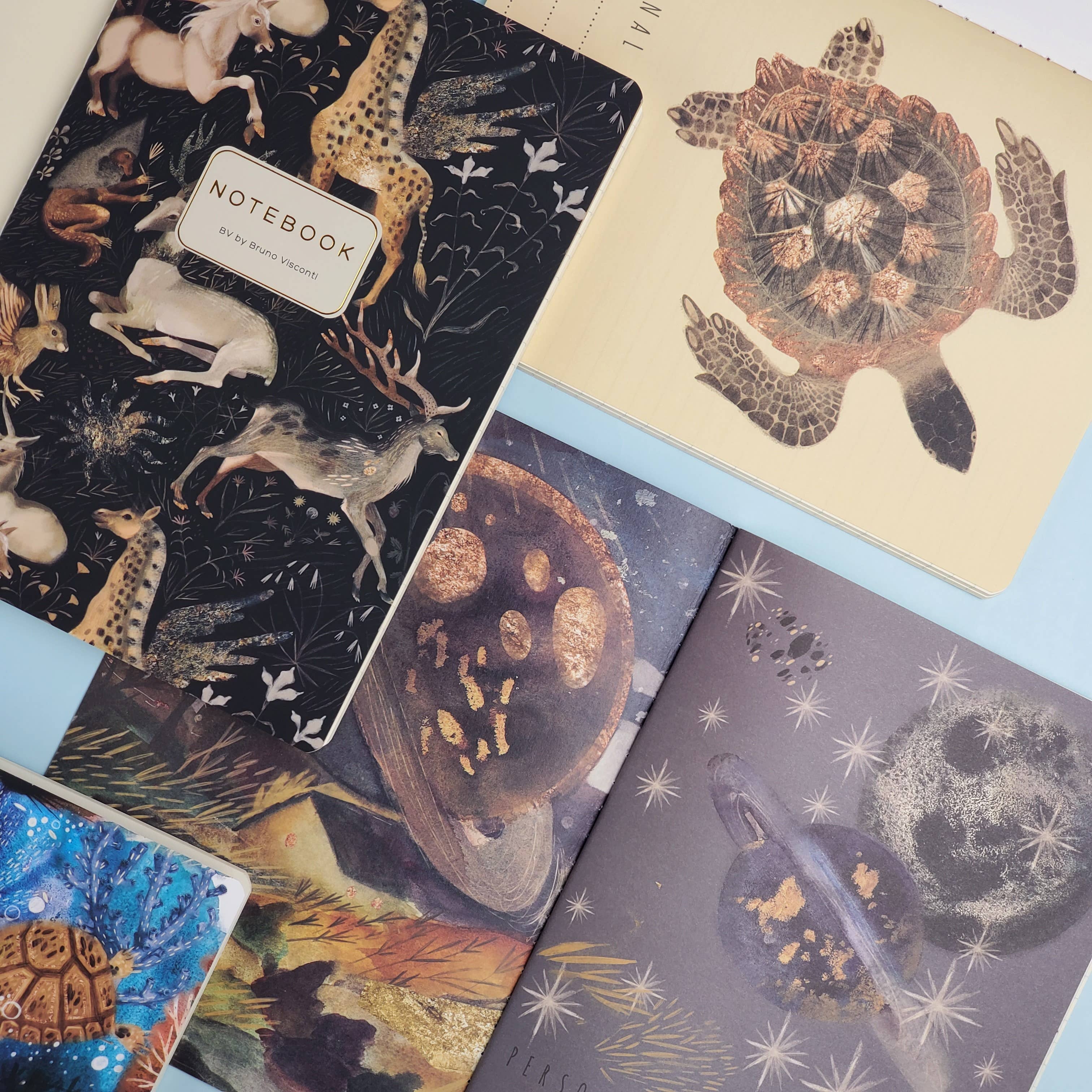 A5 ruled notebook with a galaxy and starfield cover design, interior ruled pages