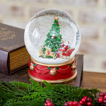 Large Christmas tree snow globe with presents on a red drum base