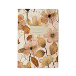 A5 ruled notebook with a blush and gold floral cover design, front cover