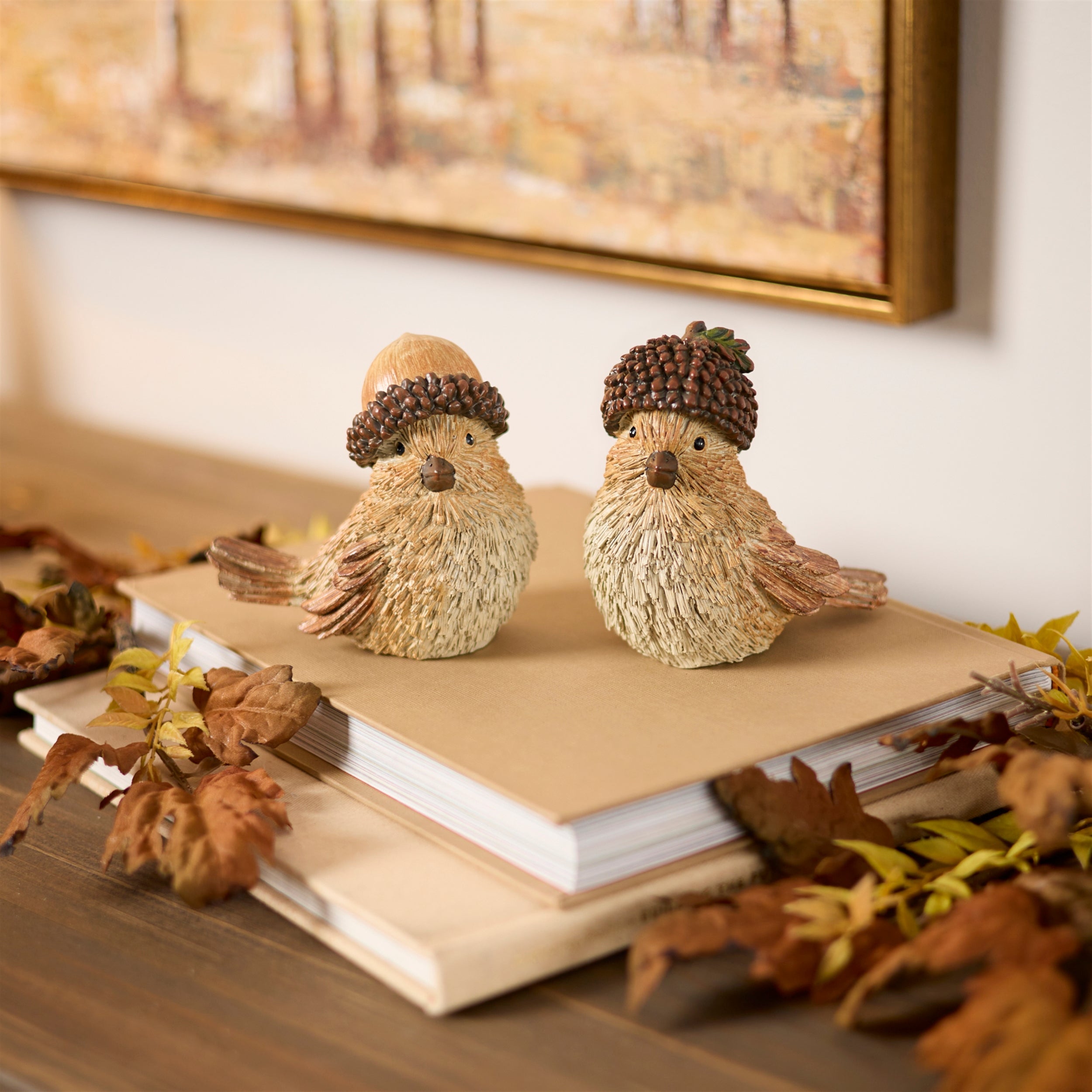 Bird with acorn hat figurine styled in a fall setting