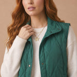 High Neck Snap Button Quilted Puffer Vest in Hunter Green - front view