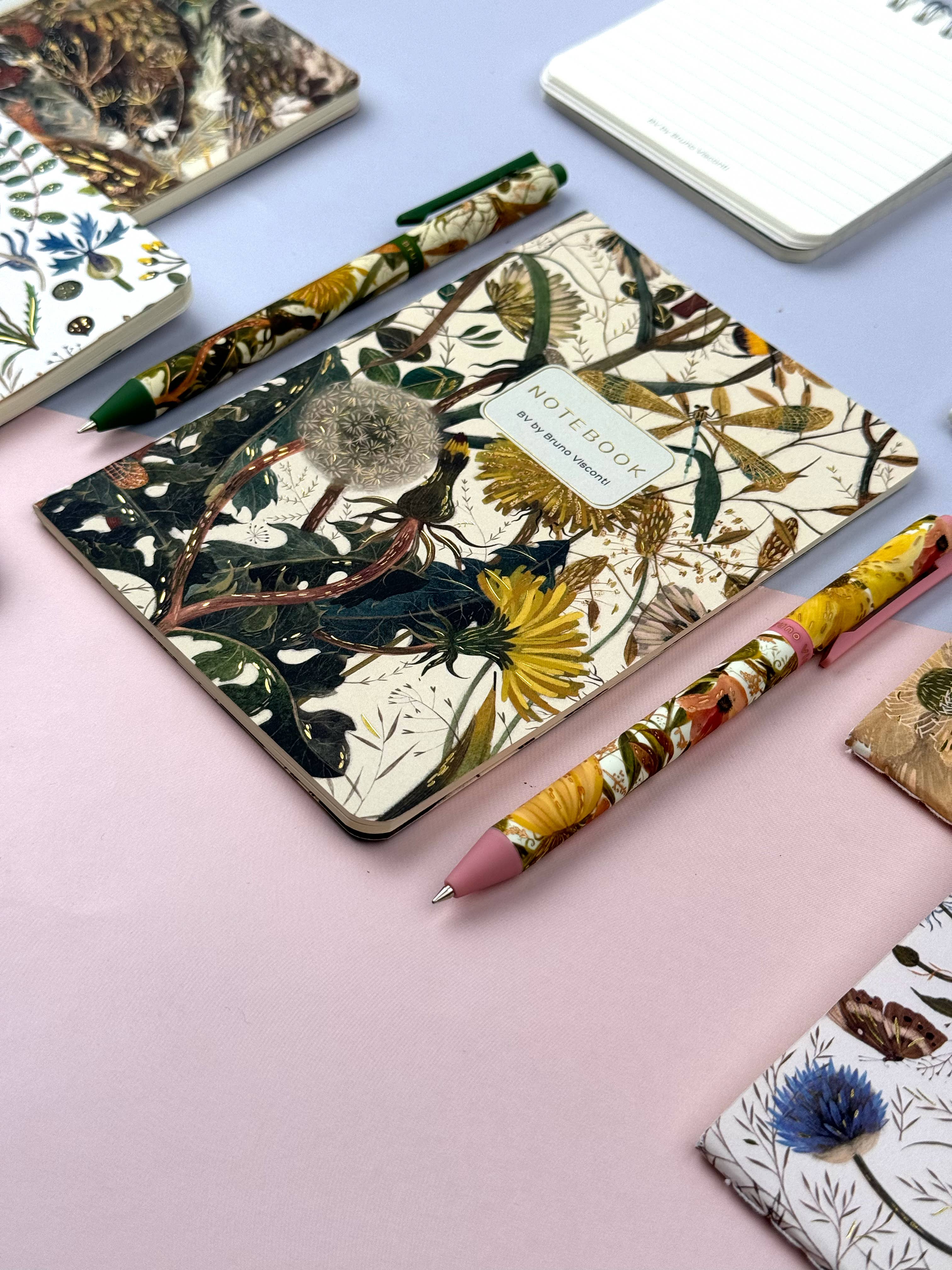 A5 ruled notebook with a green botanical cover design, detail view