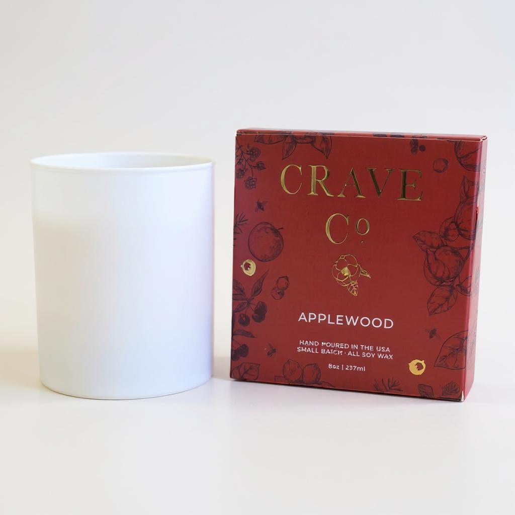 Applewood candle in matte white vessel