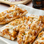 Toasted bread topped with shredded BBQ chicken, cheese and red onion