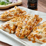 BBQ chicken flatbreads with melted cheese, red onion and cilantro made with Sweet Heat Grill & Wing Sauce
