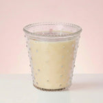 Bridgewater Sweet Grace hobnail glass candle lit, showing three wicks in cream soy-blend wax