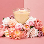 Bridgewater Sweet Grace hobnail candle glowing beside pink and white flowers