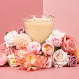 Bridgewater Sweet Grace hobnail candle glowing beside pink and white flowers