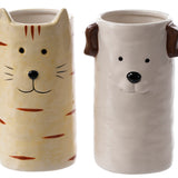Two cylindrical ceramic vases, a cream cat with orange stripes and pointed ears and a white dog with brown ears