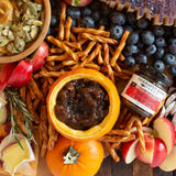 Fall charcuterie board with Butter Braided Pretzel Twists, apples, cheese and bacon jam