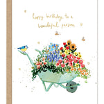 Beautiful Person Birthday Card — front: a watercolor wheelbarrow overflowing with garden flowers, a bluebird and bees, with gold foil "happy birthday to a beautiful person" lettering
