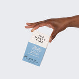 Hand holding a Minty Blue 10-count tea box
