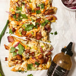 Chicken bacon flatbread pizza drizzled with Sweet Heat Grill & Wing Sauce