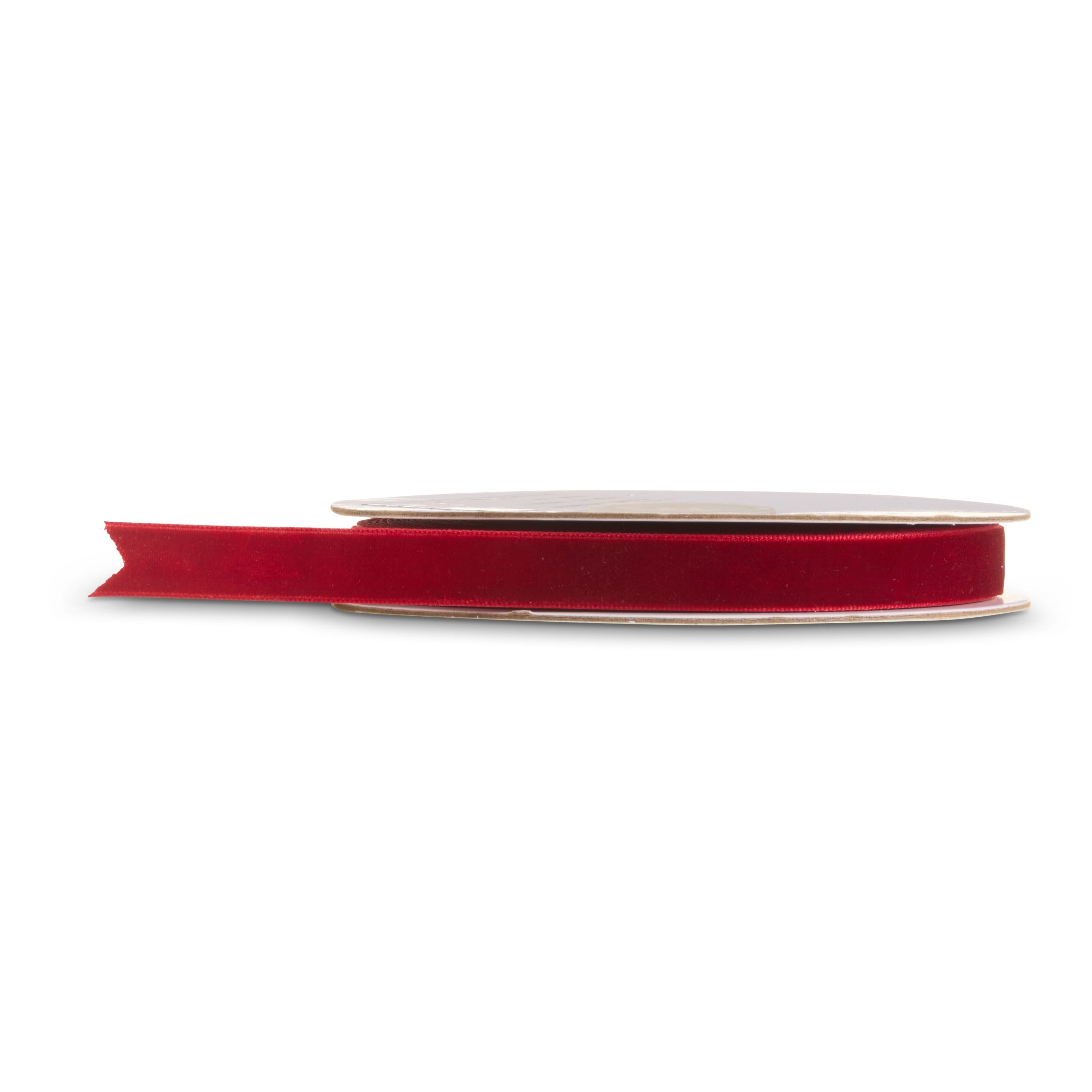 Spool of half-inch burgundy velvet ribbon partly unrolled