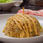 Vegetable fried rice drizzled with Bang Bang sauce
