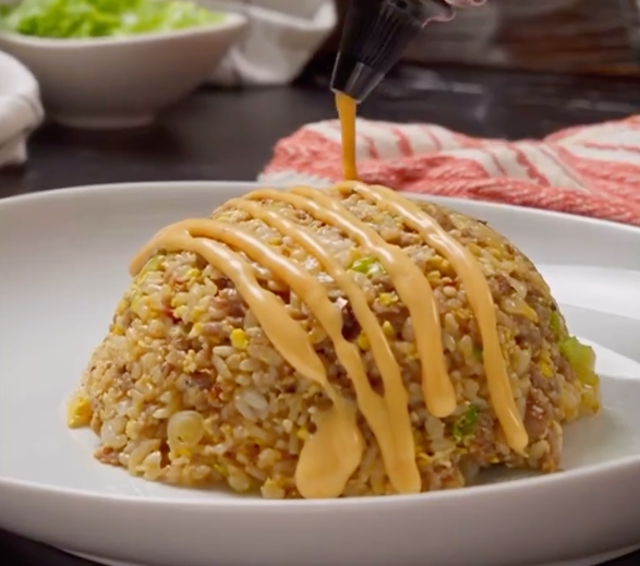 Vegetable fried rice drizzled with Bang Bang sauce
