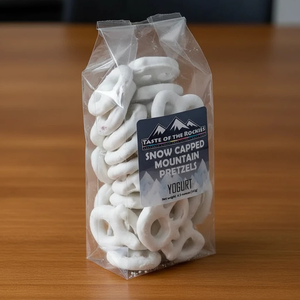 A clear plastic package containing white yogurt pretzels with a blue label that reads 'Snow Capped Mountain Pretzels, Yogurt, 4.5 ounces (125g)'.