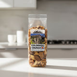 Packaged snack mix labeled 'Colorado Crunch' with a mountainous landscape on the label with Colorado logo