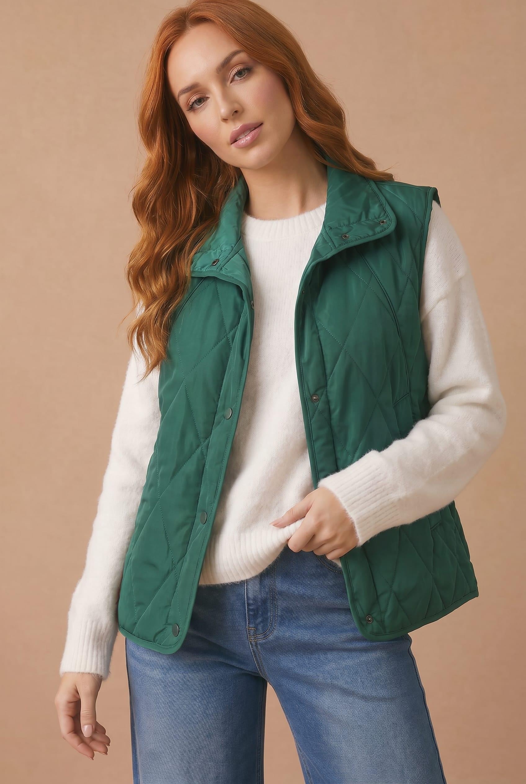 High Neck Snap Button Quilted Puffer Vest in Hunter Green - hands in pockets