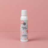 Sweet Grace Wrinkle Release Spray bottle standing on a pink surface
