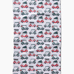 Holiday golf tea towel with golf carts carrying Christmas trees