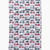 Holiday golf tea towel with golf carts carrying Christmas trees