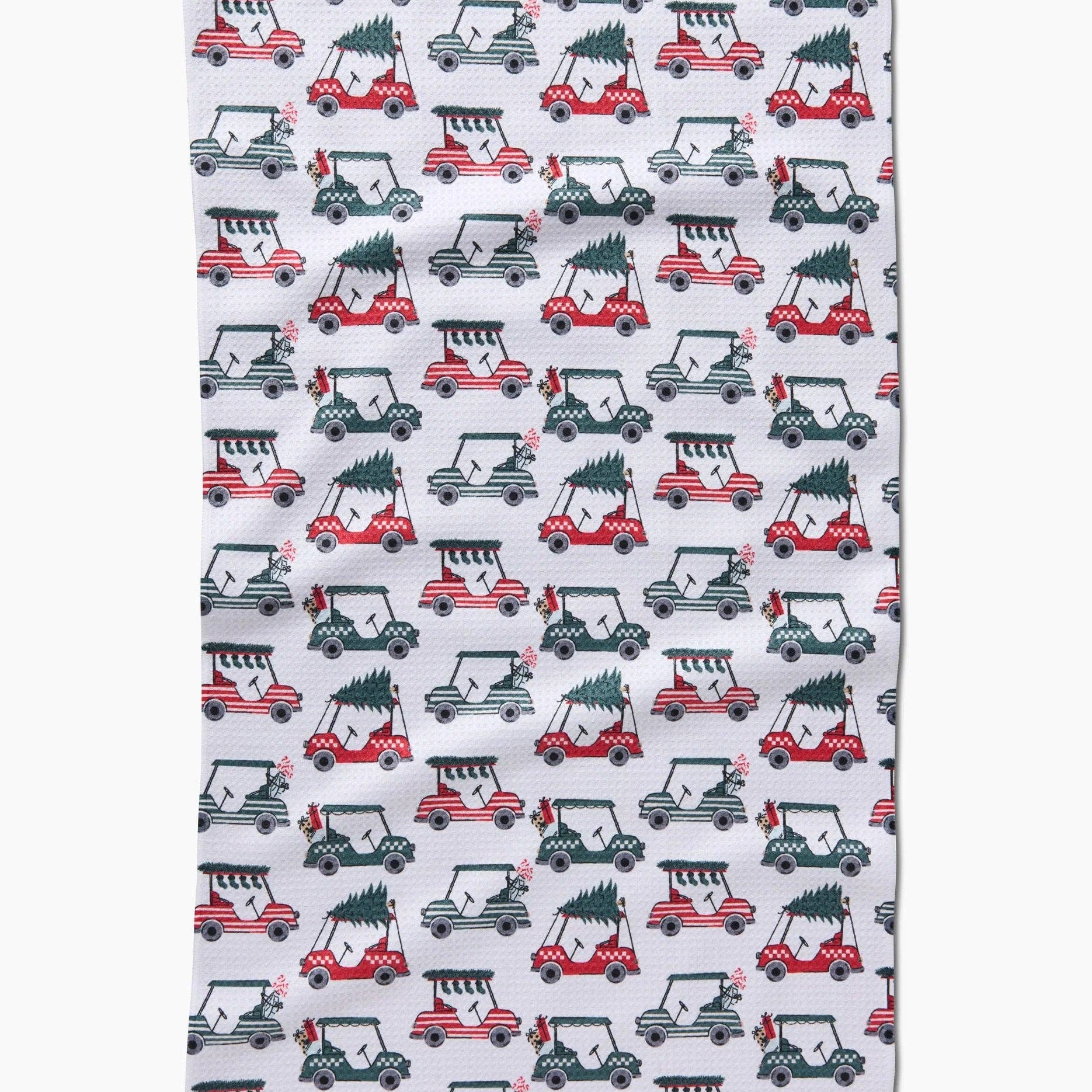 Holiday golf tea towel with golf carts carrying Christmas trees