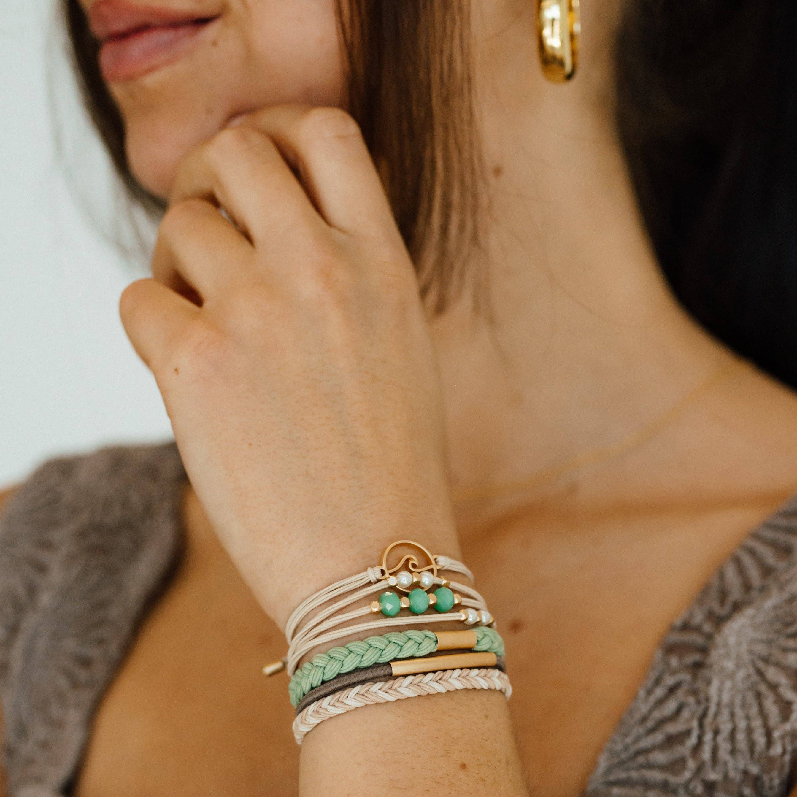 Reflect hair tie bracelet set in beachy neutrals and green with gold wave charm, view 8