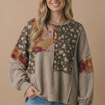 Floral patchwork knit top shown from the front, taupe and burgundy tones