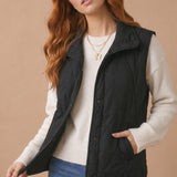 High Neck Snap Button Quilted Puffer Vest in Black - front view