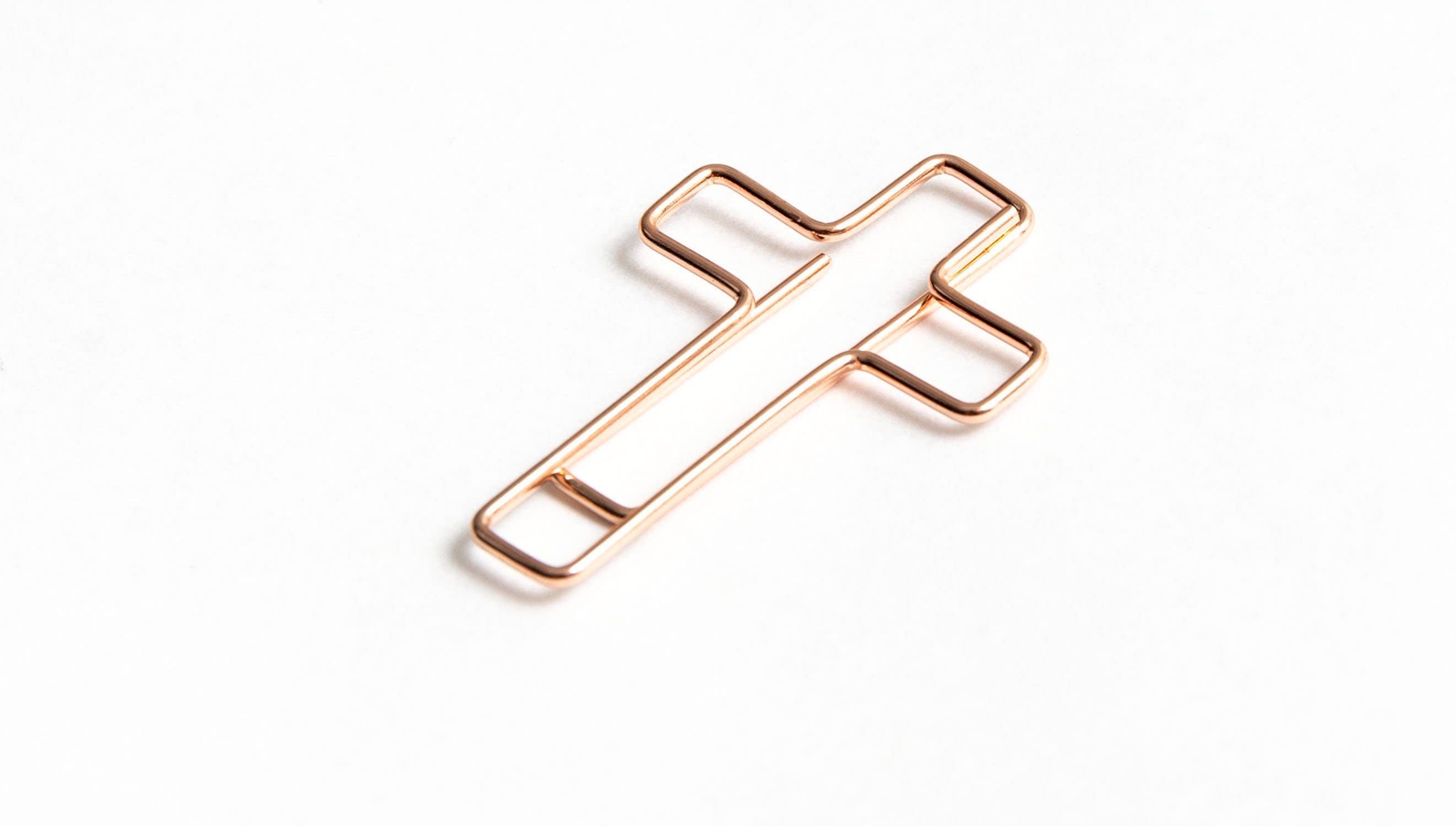 Cross paper clip detail, 0.86 by 1.3 inches