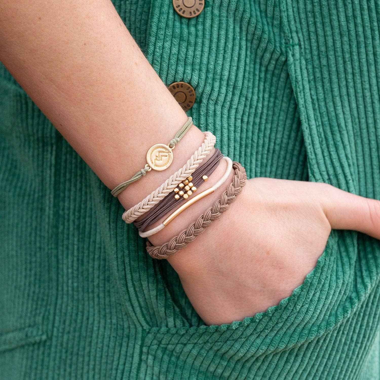 Climb hair tie bracelet set in brown, cream and green with gold mountain charm, view 7
