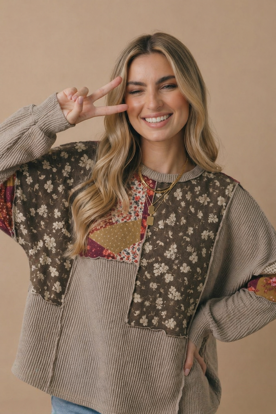 Side view of the oversized floral patchwork wave knit top