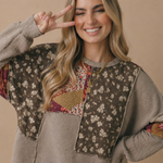 Side view of the oversized floral patchwork wave knit top