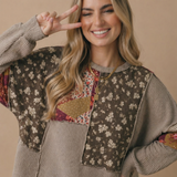 Side view of the oversized floral patchwork wave knit top