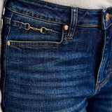 Close-up of the gold harness trim detail on the waistband of Judy Blue Daisy bootcut jeans