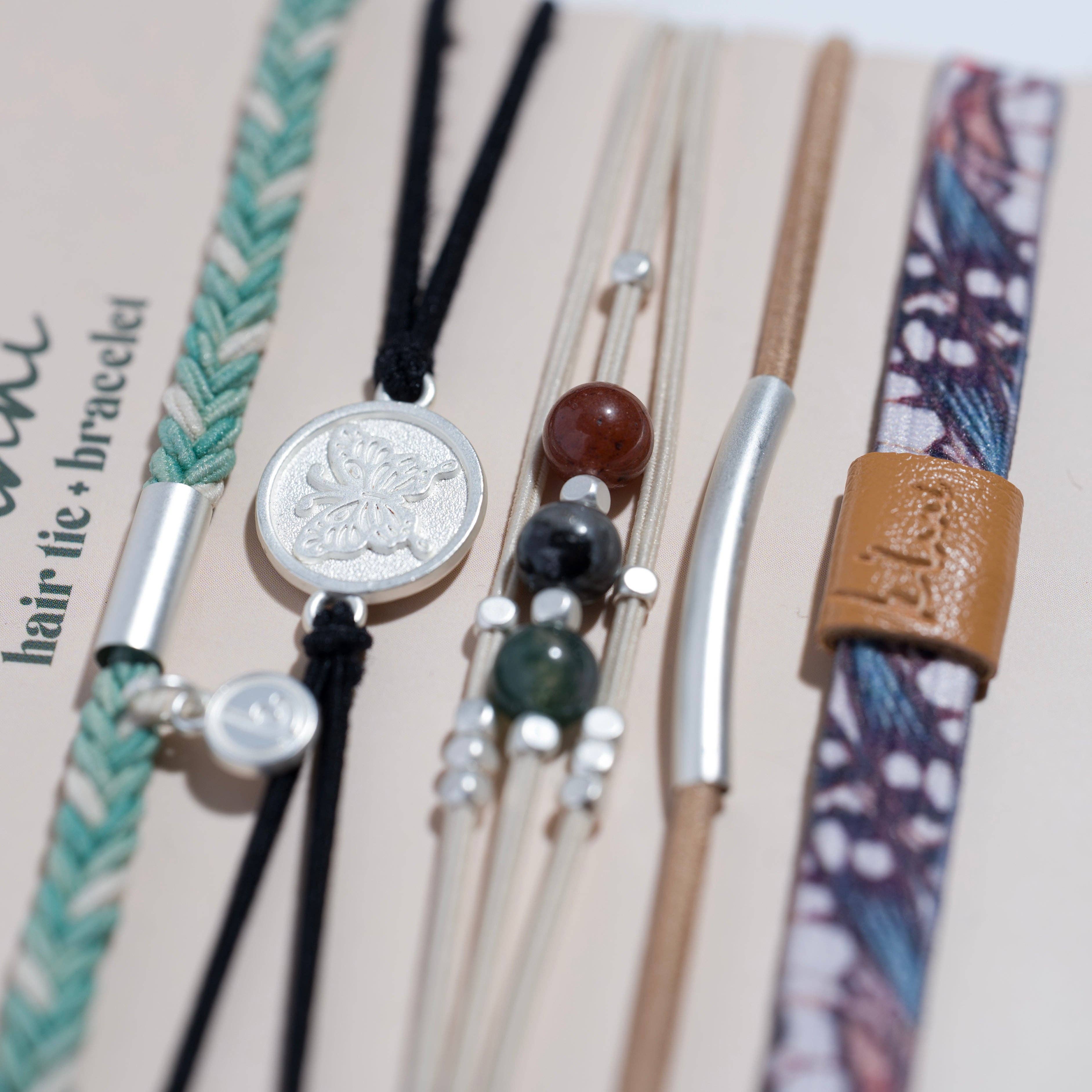 Flourish hair tie bracelet set in teal, black and tan with butterfly charm, view 3
