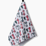 Holiday golf tea towel hanging from a hook