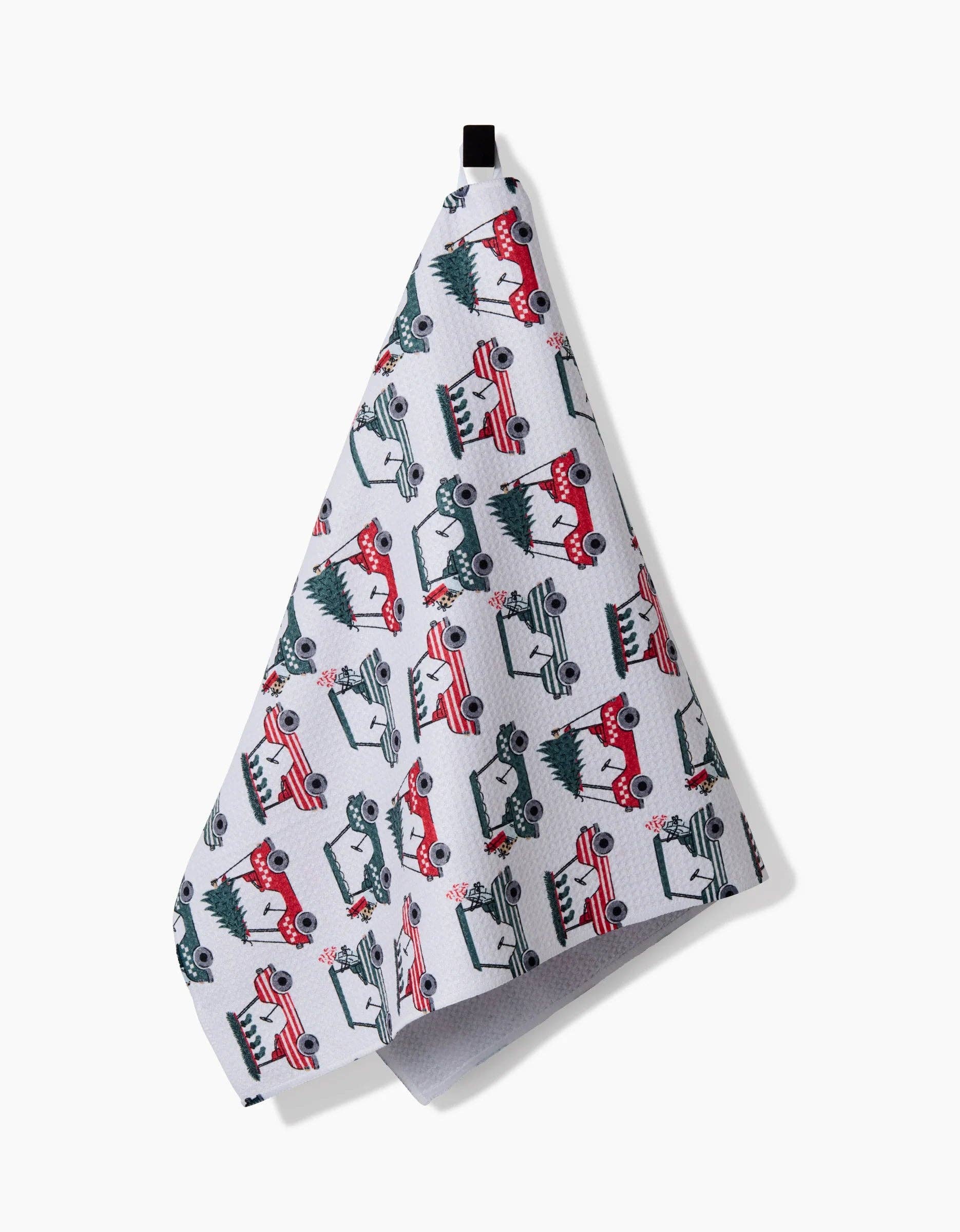 Holiday golf tea towel hanging from a hook