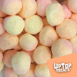 Close up of puffed peach freeze dried candy pieces from UpTop Treats