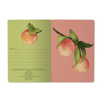A5 ruled notebook with a painted peach and foliage cover design, detail view