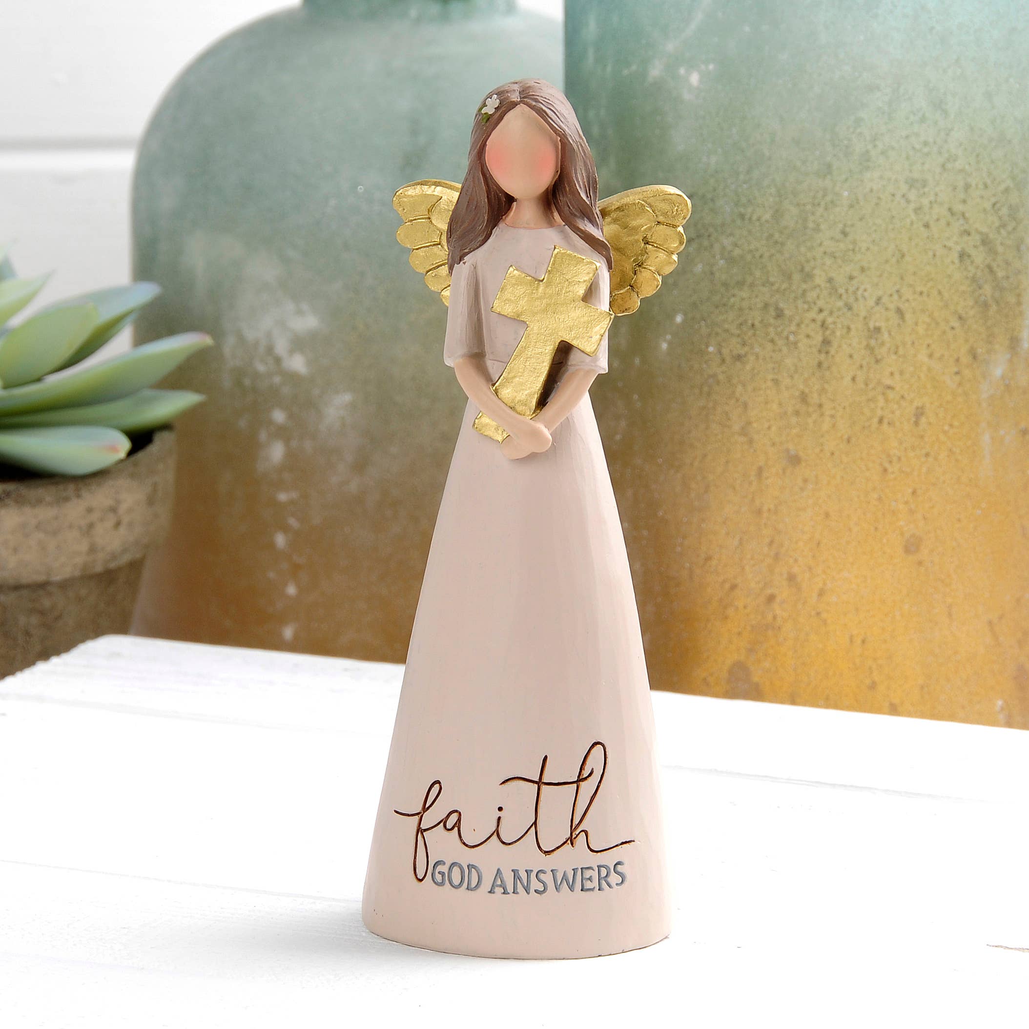 Faith God Answers angel figurine holding a gold cross