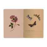 A5 soft-touch notebook with a dark floral and butterfly cover design, detail view