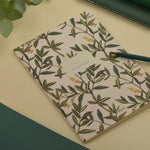 A5 soft-touch notebook with an olive branch cover design, interior ruled pages