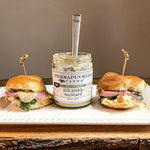 Ham and cheese sliders with an open jar of Dill Pickle Mustard