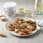 Prosciutto and cheese crostini with white wine and Balsamic Onion Jam