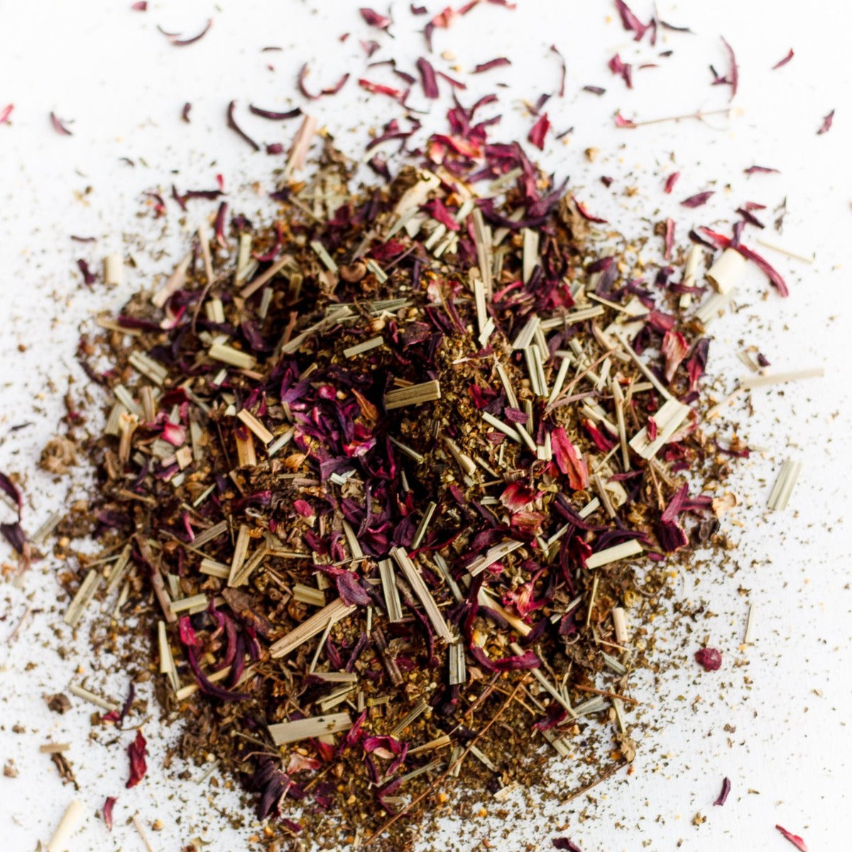 Loose hibiscus petals, lemongrass and tulsi used in Blushing tea