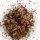 Loose hibiscus petals, lemongrass and tulsi used in Blushing tea