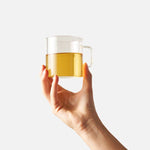 Cup of brewed Cozy Night chamomile mint herbal tea