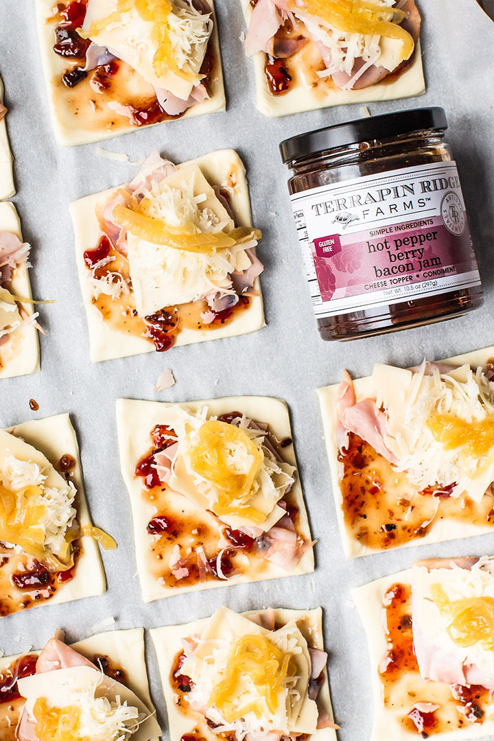 Pastry squares with ham, cheese and Hot Pepper Berry Bacon Jam before baking